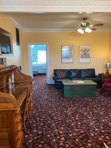 a living room with a couch and a table at Desperado - CA King Size Bed - Sleeps 2-4 in Lynchburg
