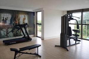a gym with two treadmills and two exercise bikes at Paiva Ocean View - 17th Floor with Pool, Sauna & Jacuzzi in Recife