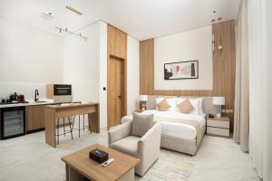 a hotel room with a bed and a desk at Liora Boutique in Riyadh