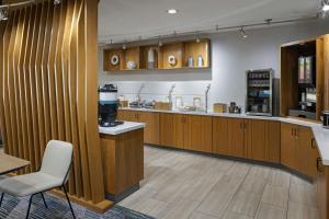 a coffee shop with a coffee maker on a counter at SpringHill Suites by Marriott Lancaster Palmdale in Lancaster
