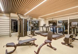 a gym with several treadmills and elliptical machines at Radisson Pinheiros in São Paulo