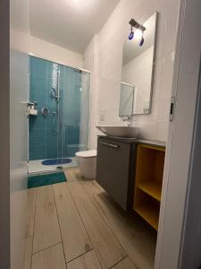 a bathroom with a sink and a shower and a mirror at Bellanotte suite and dreams in Bellano +52 photos