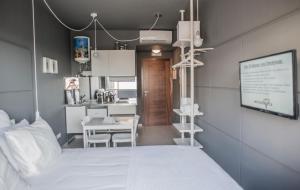 a hospital room with a bed and a table at Fuerteventura in Loft in Gran Tarajal