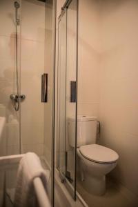 a bathroom with a toilet and a shower at Fuerteventura in Loft in Gran Tarajal
