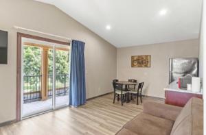 a living room with a couch and a table at Edgewater Hotel and Suites in Put-in-Bay