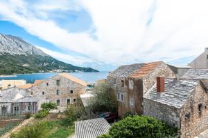 an old town with a view of the water at Apartment Bezerusa in Igrane