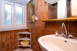 a bathroom with a sink and a toilet at Apartment Bezerusa in Igrane +18 photos