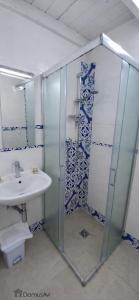 a bathroom with a glass shower and a sink at Domus Avi - Bed and Breakfast in Taviano +25 photos