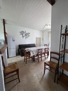 a large living room with a table and chairs at Gîte Le Campagnard in Saint-Germain-des-Bois +8 photos