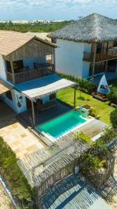 an aerial view of a house with a swimming pool at Casa da Duna in Tatajuba