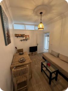 a living room with a couch and a table at White House TAMRAGHT in Agadir