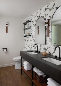 a bathroom with a sink and a mirror at All Seasons River Inn in Leavenworth +60 photos