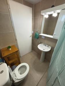 a bathroom with a toilet and a sink at Cabañas boutique la soñada BIS in Fiambalá +11 photos