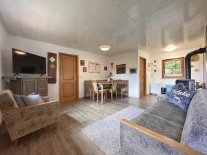 a living room with a couch and a table at Haus Anna in Stadlern