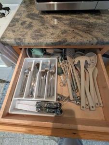 a table with a bunch of knives and utensils at Comfortable living, within reach! in Oak Park