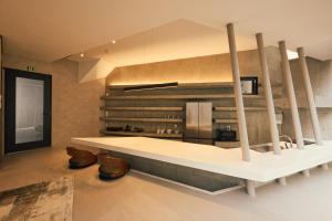 a kitchen with a white counter and a stove at Crane Stay Shibuya in Tokyo +65 photos