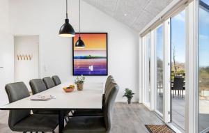 a dining room with a table and chairs at Stunning Home In Hasle With Sauna in Hasle