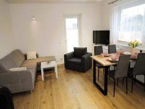 a living room with a couch and a table at New apartment in Wise ka in Wisełka