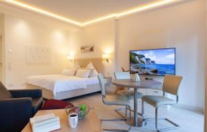 a hotel room with a bed and a table at Baltic in Binz