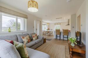 a living room with a couch and a table at 2 Bed in Llangasty oc-d39006 in Llangorse