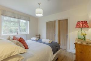a bedroom with a bed and a window at 2 Bed in Llangasty oc-d39006 in Llangorse