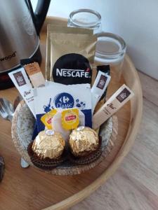 a plate of food with a basket of pastries at TIARE - City center room Papeete in Papeete