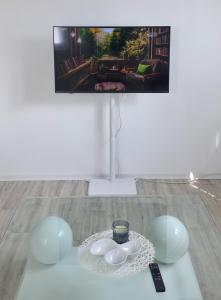 a table with a plate and a candle on it at Weserblick Apartment Stolzenau 24h Selfcheckin in Stolzenau