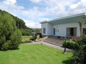 a small white house with a grass yard at Le Beau Souvenir, Noiseux in Noiseux +25 photos