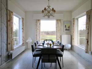 a long dining room with a long table and chairs at Le Beau Souvenir, Noiseux in Noiseux