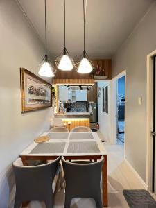 a dining room with a table and chairs at Miestee's Happy Homes in Lapu Lapu City