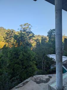 a view from the balcony of a house with trees at Luxforge home in Bandarawela