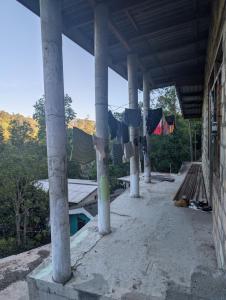 a building with clothes drying on thelines of pillars at Luxforge home in Bandarawela