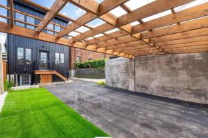 an outdoor patio with a wooden pergola at Toronto Midtown Luxury Living in Toronto