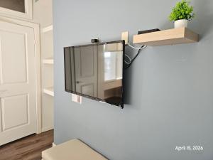 a mirror hanging on a wall in a room at Modern apartment by Playas Bullring in Tijuana