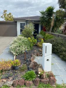 a garden in front of a house with plants at Eastern Suburbs Gem in Forest Hill