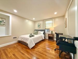 a bedroom with a bed with a stuffed animal on it at North Haven Rooms in North Haven