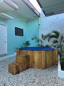 a blue room with a table with a blue top at 2BR w/mini dipping tub + 2 mins to beach in Mati