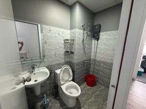 a bathroom with a toilet and a sink and a shower at Sun's house in Phan Rang–Tháp Chàm