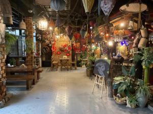 a room filled with lots of plants and lights at Redhouse Dalat Hotel in Da Lat