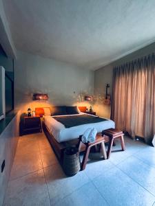 a bedroom with a large bed and a table at Bernardino in Valladolid