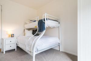 a white bunk bed in a white room at Salty Breeze on Graeme in Dromana +29 photos