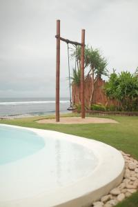 a swimming pool with a view of the ocean at Bubble 1 - Romantic Private Pool Love Dome Uluwatu in Uluwatu