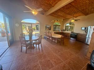 a kitchen and dining room with a table and chairs at The Sanctuary above Lo De Marcos in Lo de Marcos