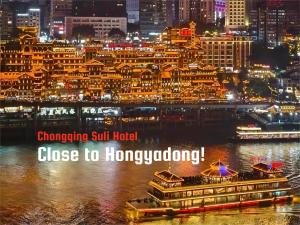 a view of a city at night with the words changingjit hurt hotel close to at Suli Hotel Chongqing,1 Min Walk to Metro,Near Jiefangbei&Hongya Cave,International guest-friendly,Free Self-Service Laundry,Free High-Speed WiFi,Free Chinese Tea,Free Travel Advice in Chongqing