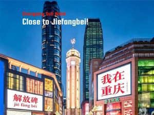 a group of tall buildings in a city at Suli Hotel Chongqing,1 Min Walk to Metro,Near Jiefangbei&Hongya Cave,International guest-friendly,Free Self-Service Laundry,Free High-Speed WiFi,Free Chinese Tea,Free Travel Advice in Chongqing