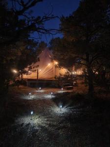 a tent with lights in front of it at night at Issachar Tent in Duchesne