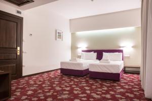 Voodi või voodid majutusasutuse Hotel Relax Craiova toas