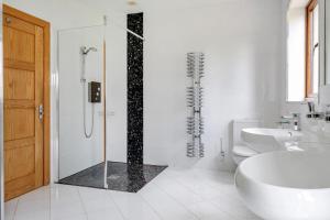 a bathroom with a shower and a toilet and a sink at Manor House in Chesterfield +38 photos