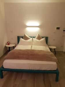 Postel nebo postele na pokoji v ubytování B&B Perbacco Relax