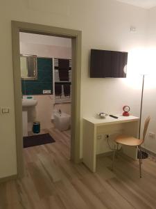 TV a/nebo společenská místnost v ubytování B&B Perbacco Relax